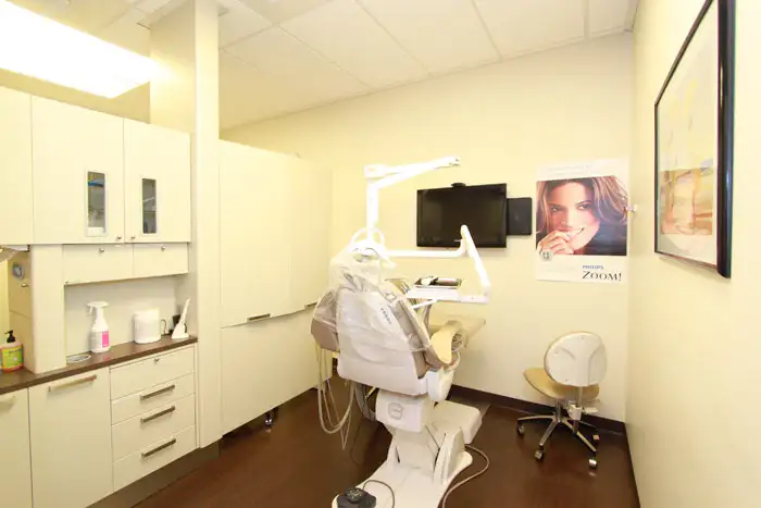 Cosmetic dentist in Bellevue performing a teeth whitening procedure at Bellevue Prime Dental Group