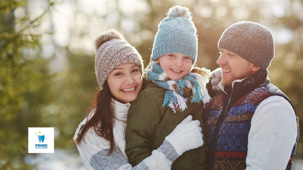 Happy family bundled up in winter clothes enjoying time outdoors.