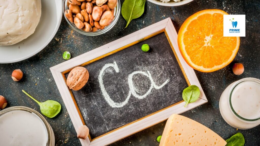 Nutrient-rich foods like cheese, nuts, orange slices, and milk with a chalkboard showing "Ca" for calcium.