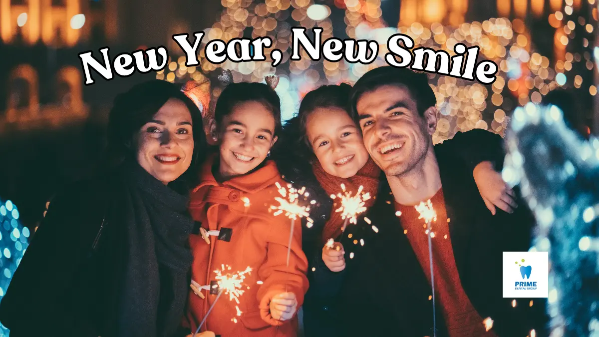 Dental Resolutions - A happy family celebrating New Year with sparklers, showcasing bright smiles and joy.