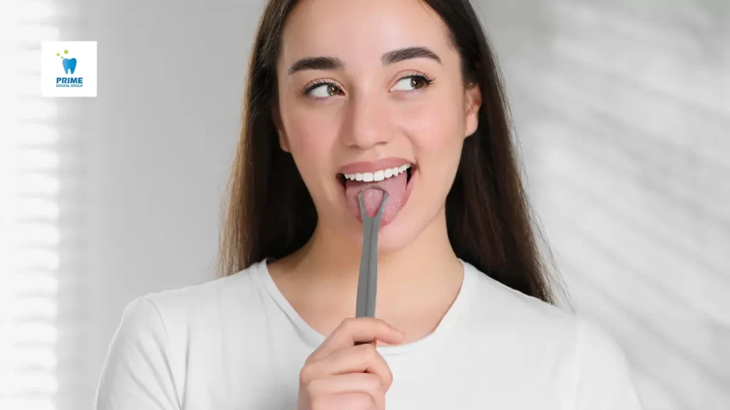 A young woman using a tongue scraper to remove bacteria and freshen her breath, promoting good oral hygiene.