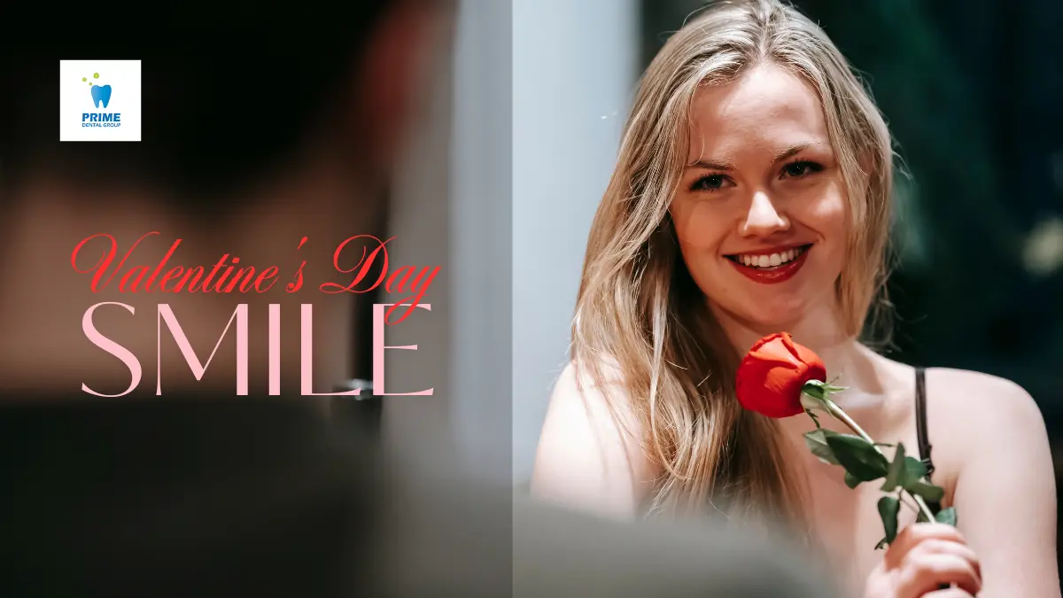 A smiling woman holding a red rose on a romantic Valentine’s Day date, with the text “Valentine’s Day Smile” and a Prime Dental Group logo