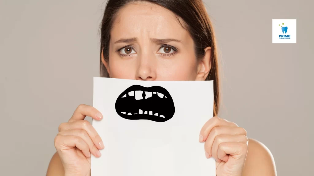 A worried woman holds a paper with a cartoon image of damaged teeth over her mouth, symbolizing dental issues and the need for orthodontic care.